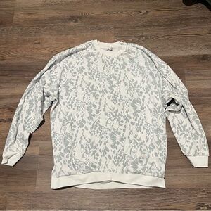 Gymshark Woman’s White and Blue Patterned Sweater with Purple Logo